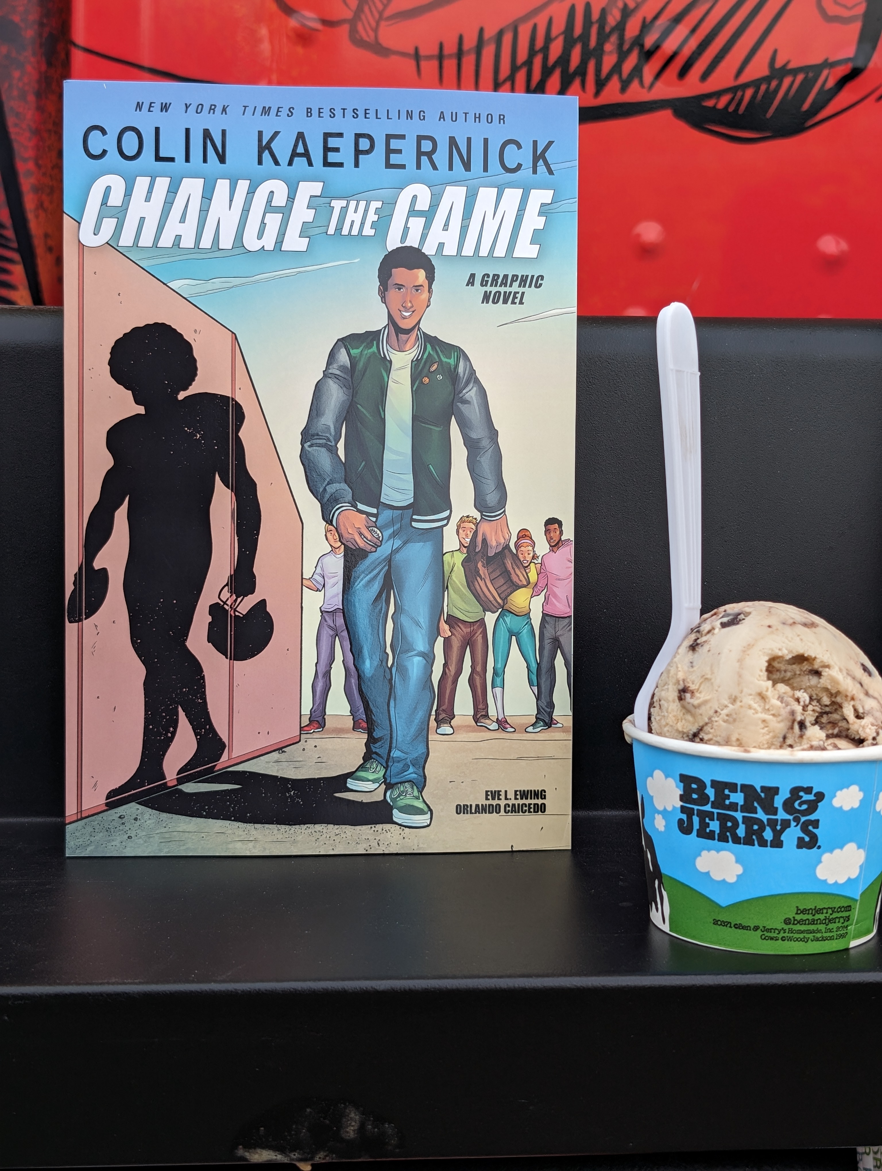 Photo of a banned book with a scoop of Ben & Jerry's ice cream next to it.