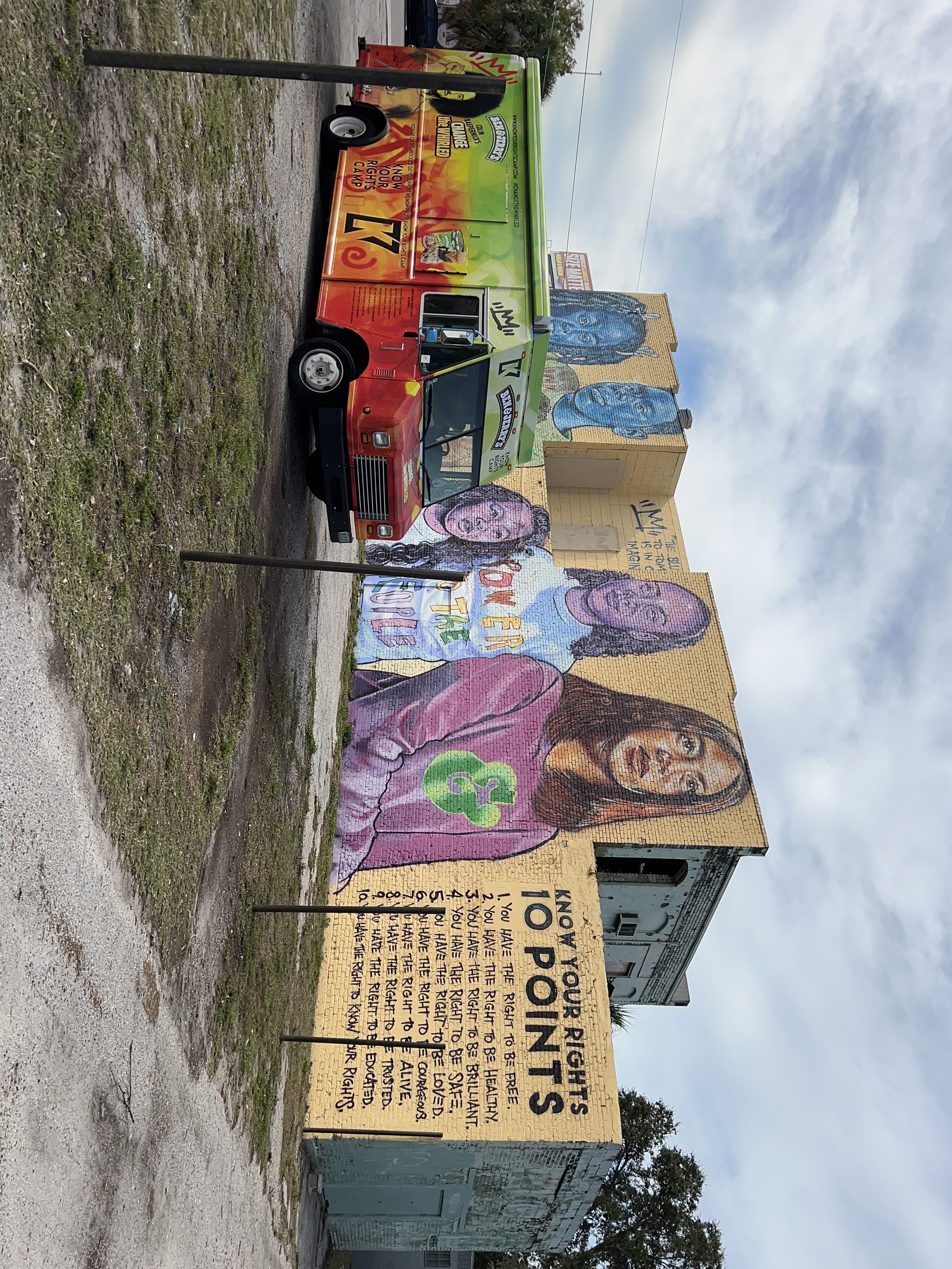 Ben & Jerry's scoop truck next to a Know Your Rights Camp mural in Tampa, FL