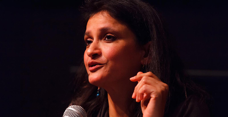 Anuradha Mittal speaking at a speaking engagement.