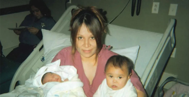 Crystal Munoz in a hospital bed with her two daughters.