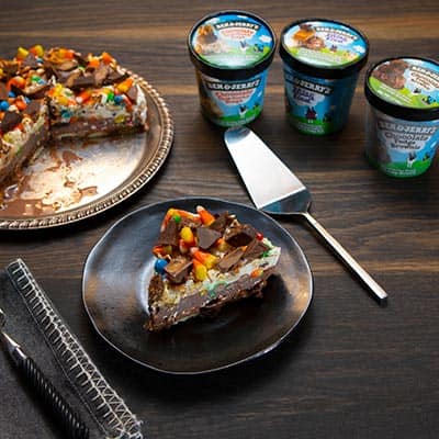 3 pints of Ben & Jerry's ice cream next to the Halloween treats ice cream cake.