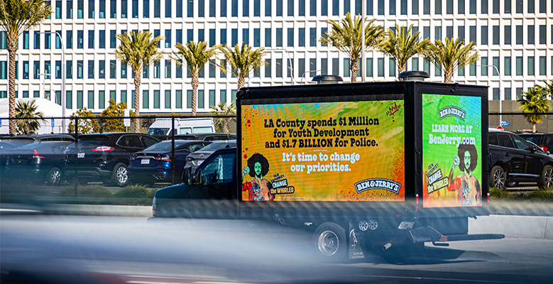 Billboard in Los Angeles that reads: LA County spends $1 million for youth development and $1.7 BILLION for police. It's time to change our priorities.