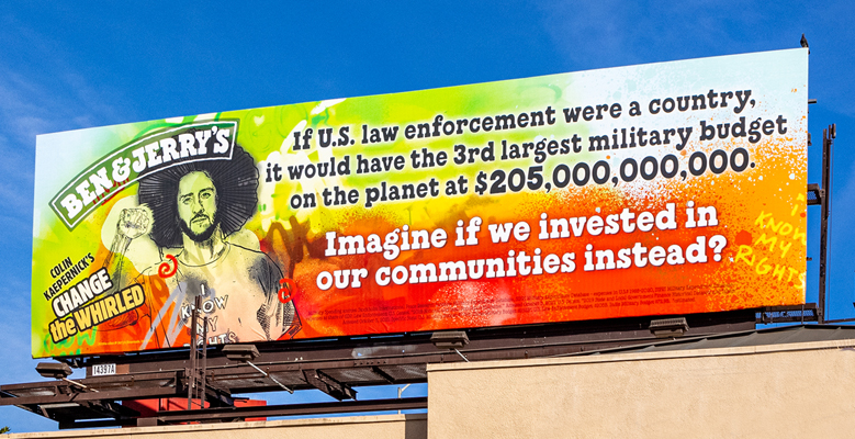 Billboard showing Colin Kaepernick in Los Angeles. Text reads: If US law enforcement were a country, it would have the third largest military budget on the planet at $205,000,000,000. Imagine if we invested in our communities instead.